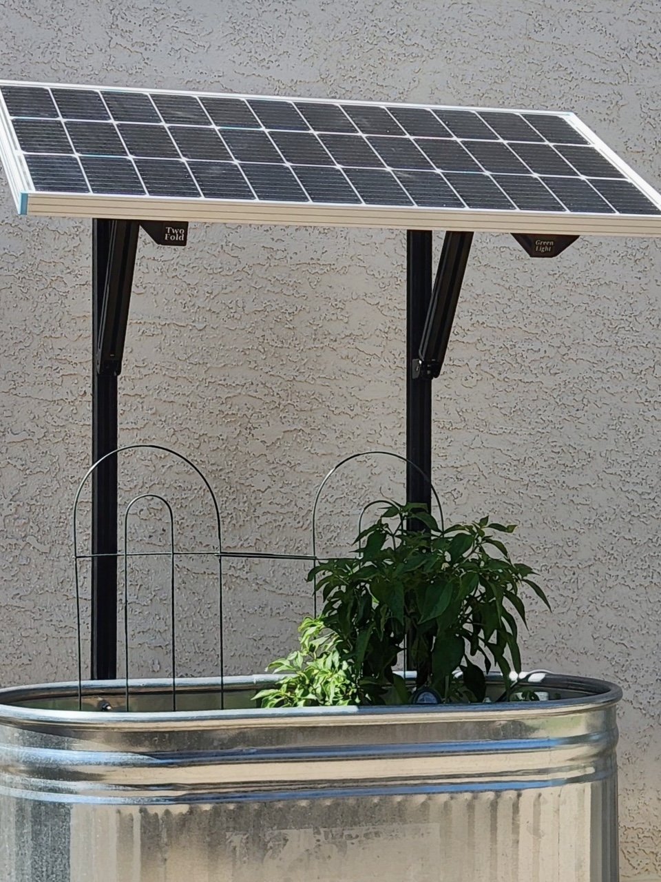 Greenlight garden with an elevated solar canopy over a raised planter bed